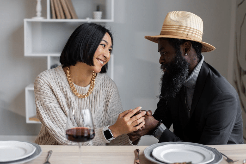 Happy diverse couple having dinner