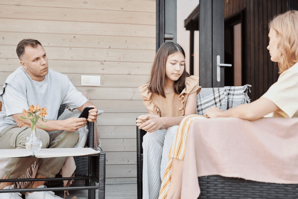 A family sitting on the patio