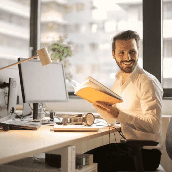 A man holding a book
