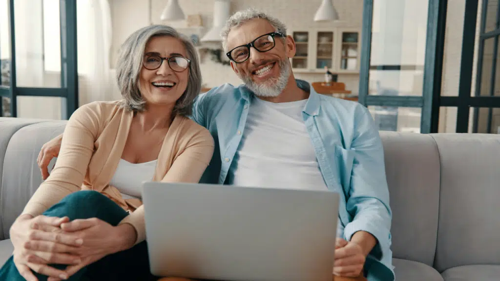 A mature couple smiling at the camera