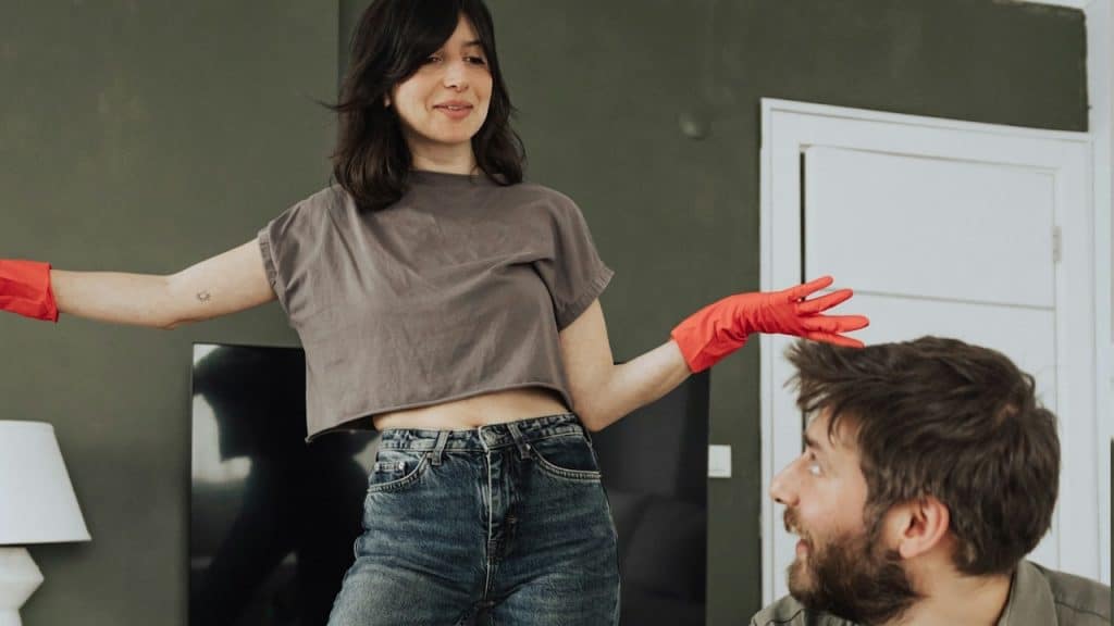 A man and a woman in a living room.