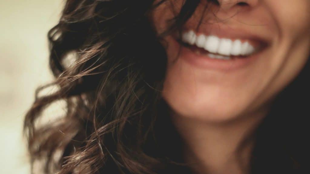 A woman smiling.
