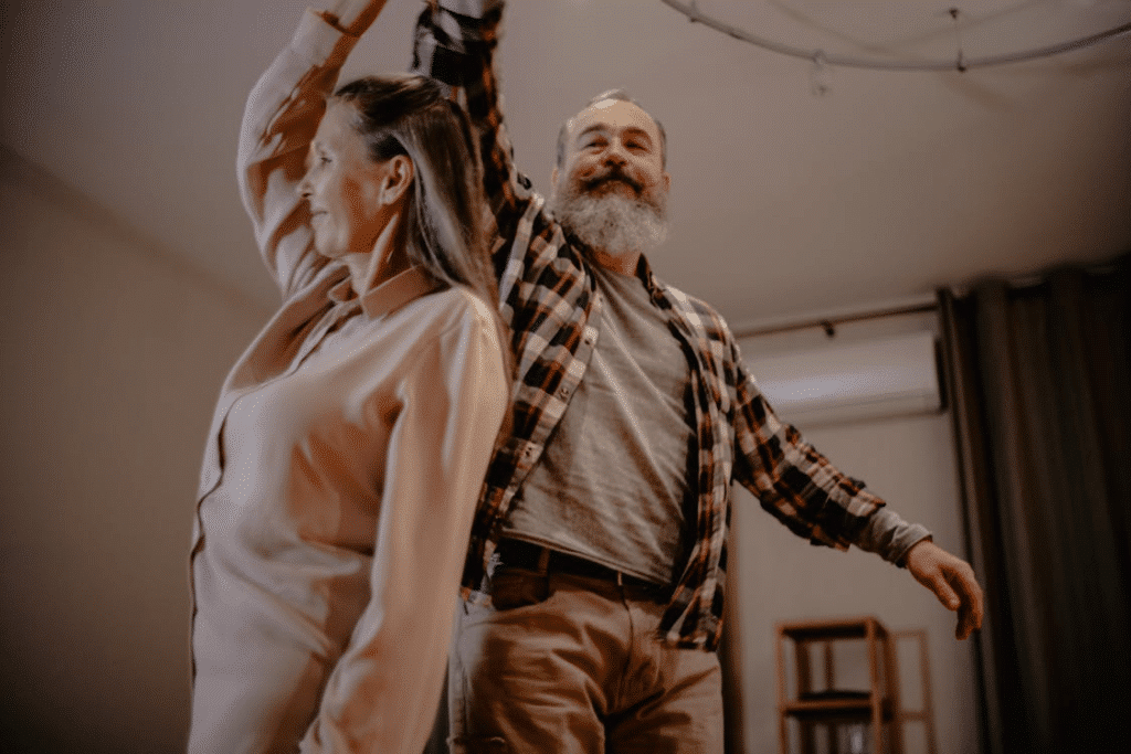 An Elderly Couple Dancing in a Living Room