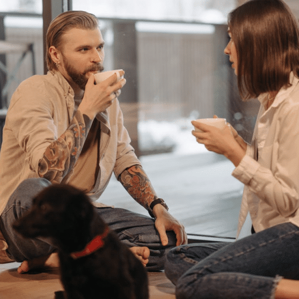A couple drinking on the floor