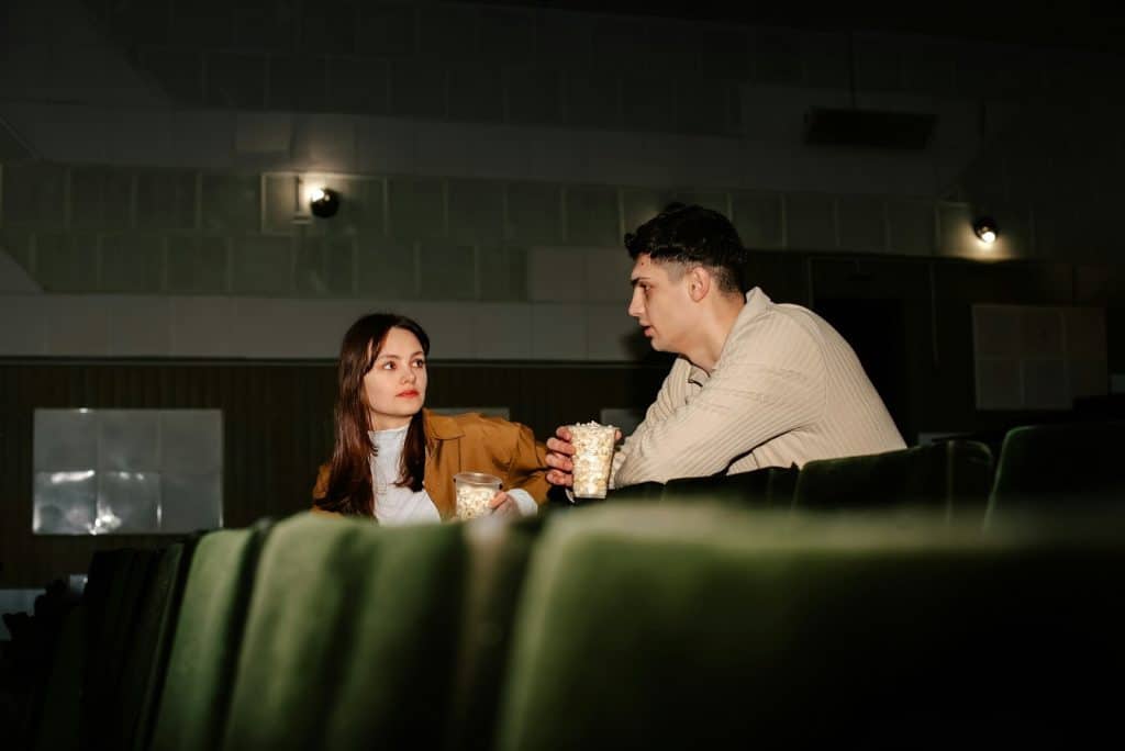 The couple is in a cinema.