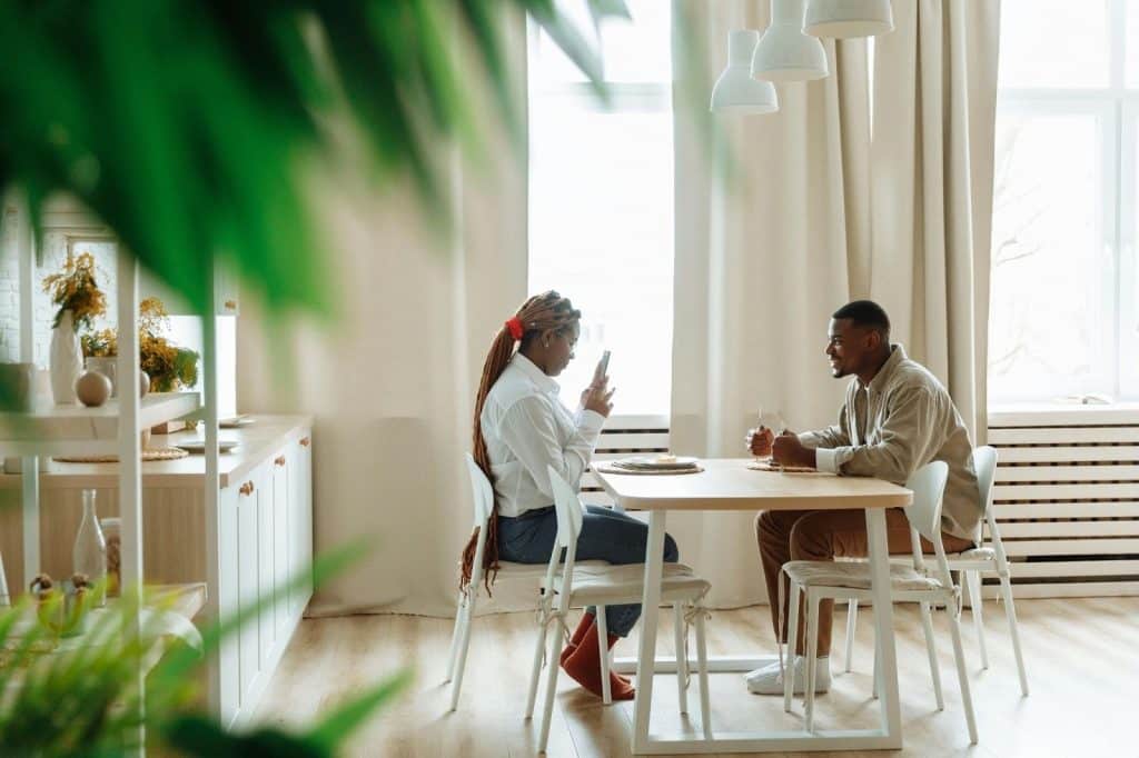 A man and woman sitting at the table