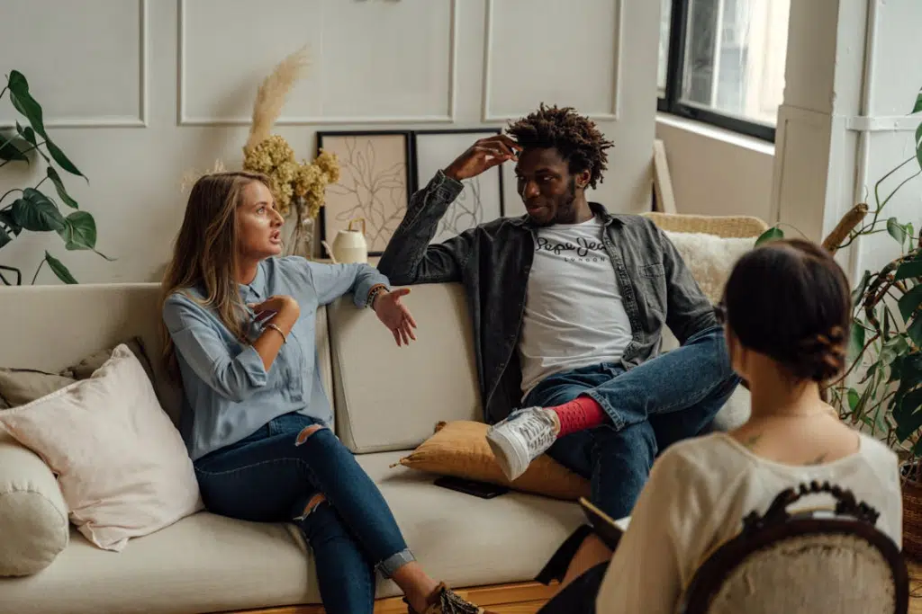A couple talking on a sofa