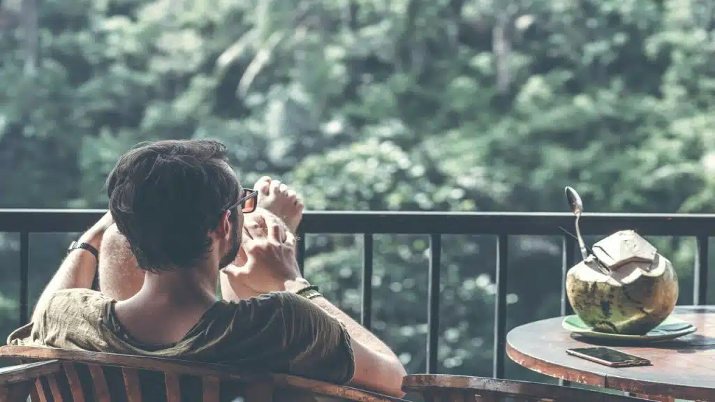 A man relaxing on a balcony
