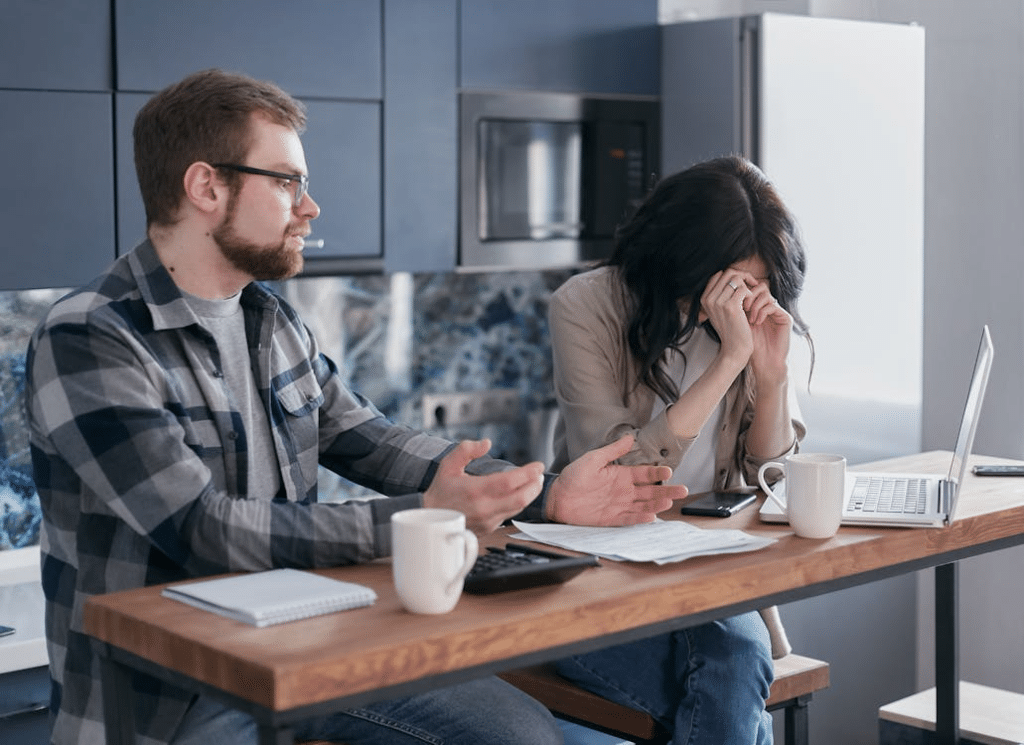 A Couple Sitting at a Desk