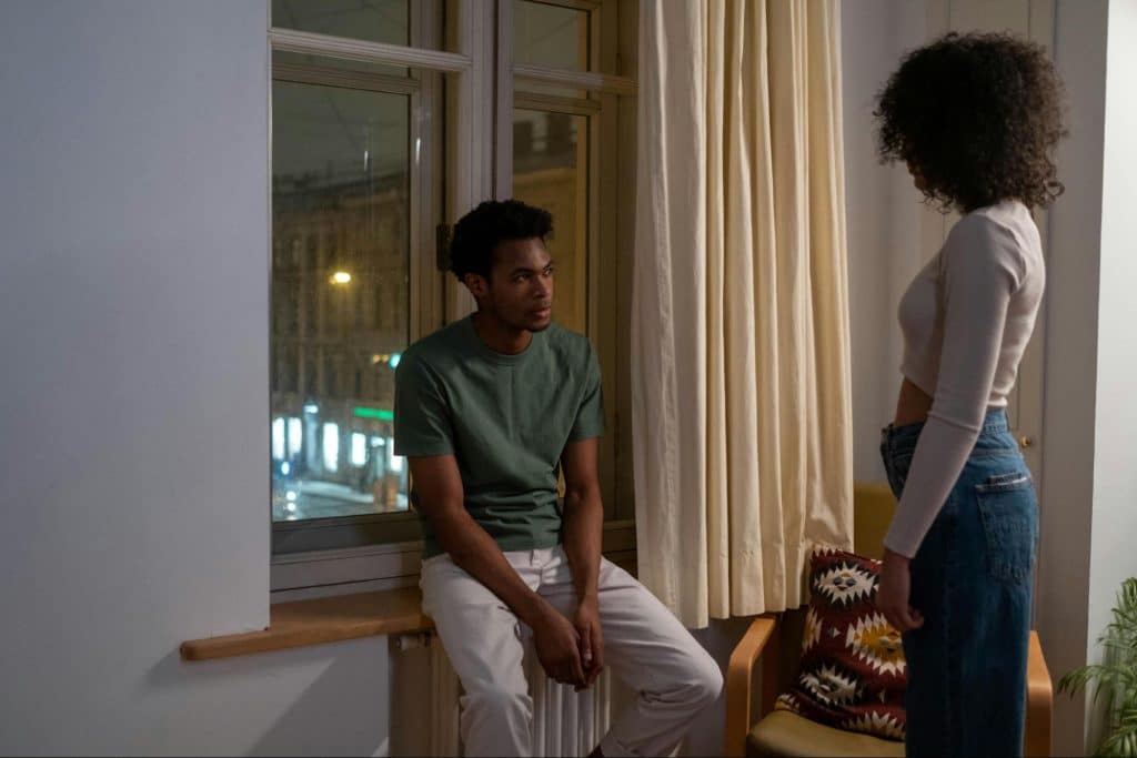 A man and woman looking at each other