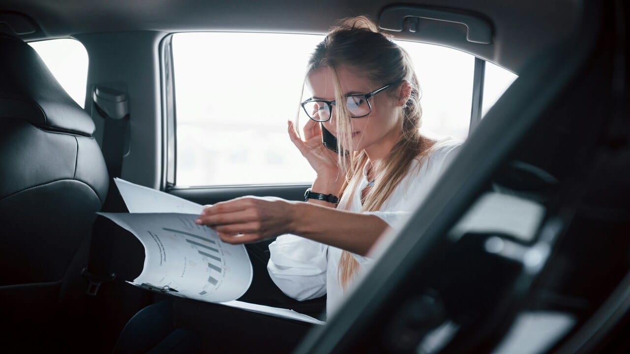 A woman busy in the car