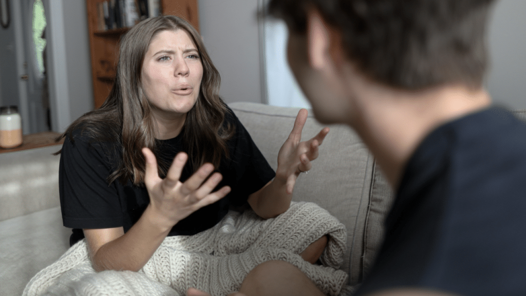 A woman crying while talking to a man