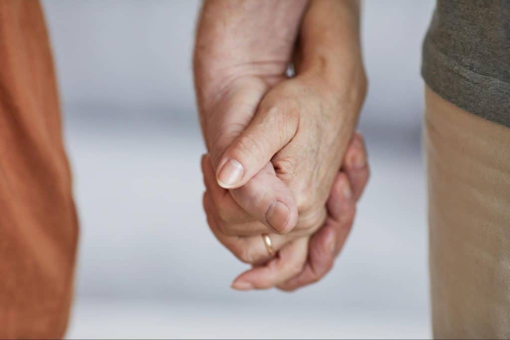 A man and woman holding hands