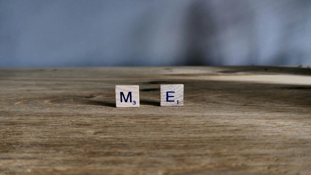 Scrabble letters spelling out “me” 