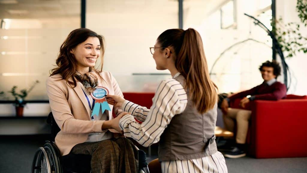 A woman receiving an employee of the month award