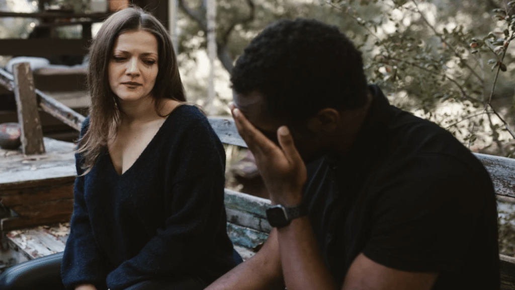 A couple crying while talking