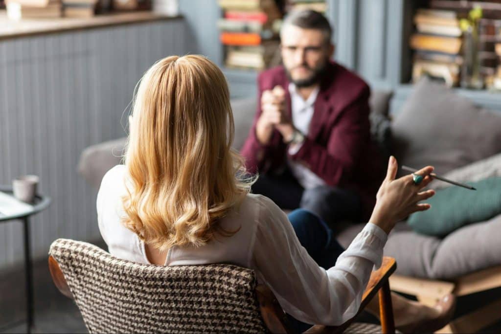 A woman talking to man