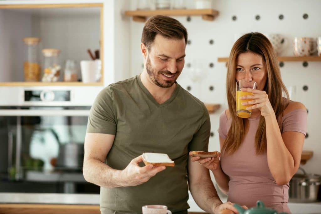A man and woman at the kitchen