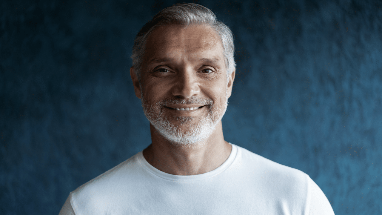 A man smiling at a camera