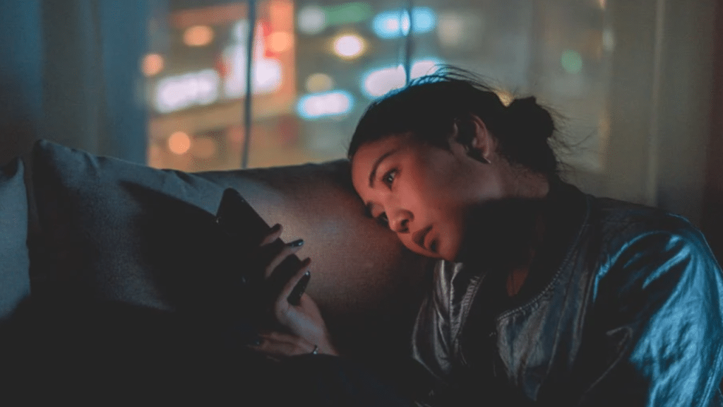 A woman looking sad while texting