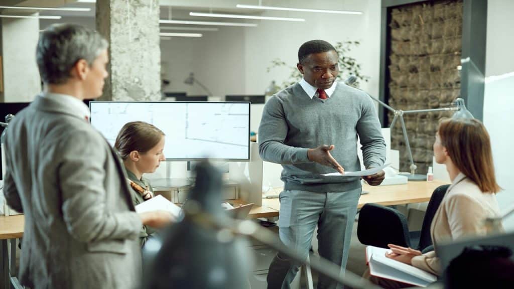 A man talking to his team