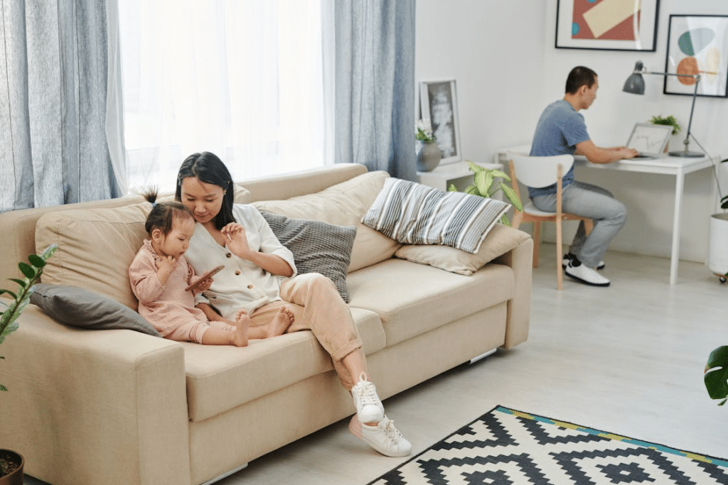 A woman and a child sitting on a couch
