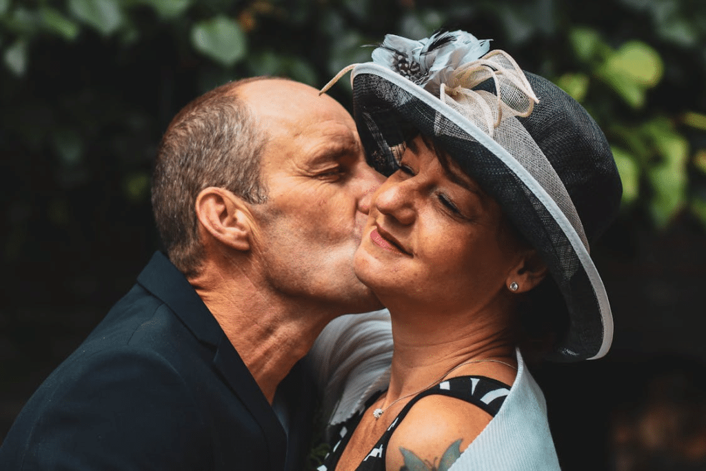 A man kissing a woman