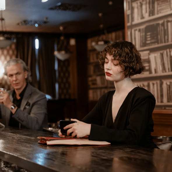 A man and a woman at a bar