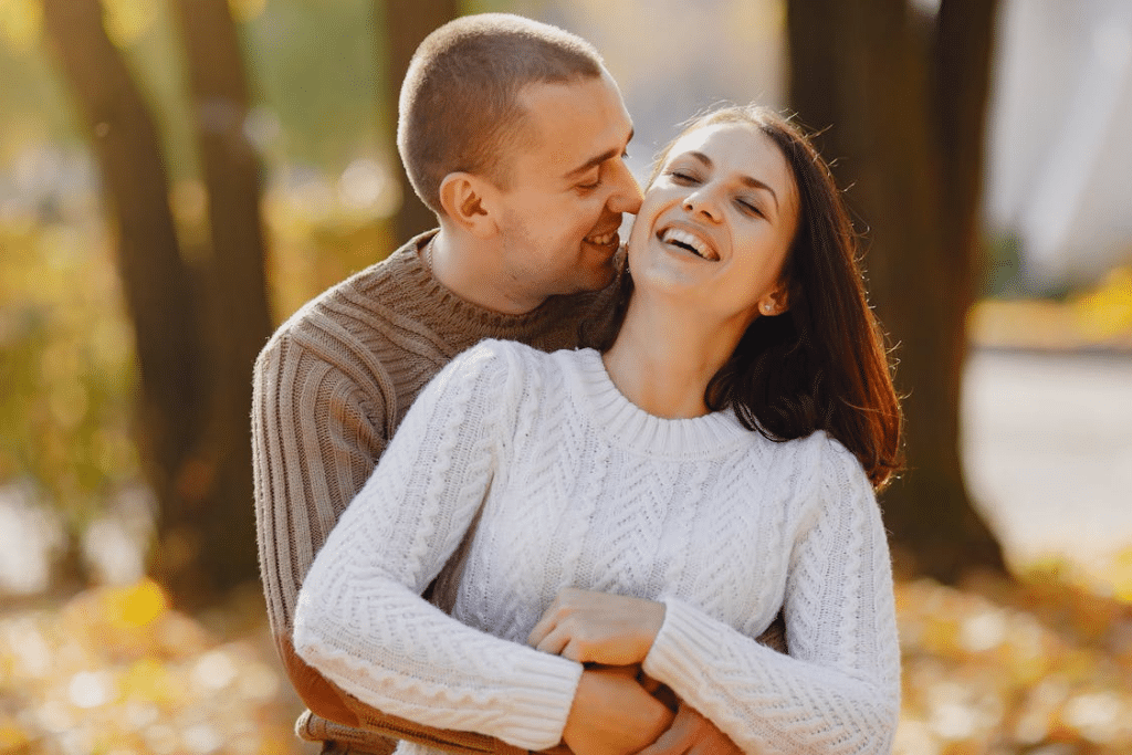 A man and a woman smiling