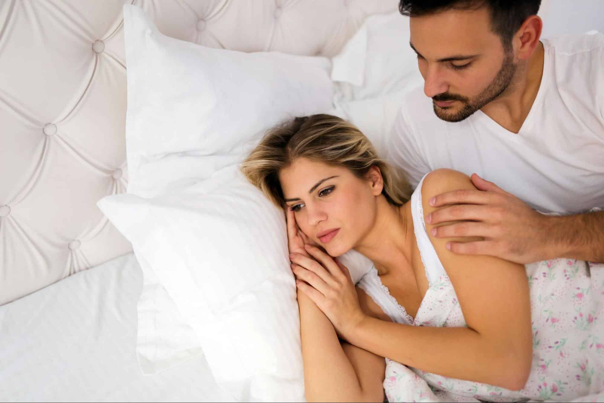 A man checking on a woman