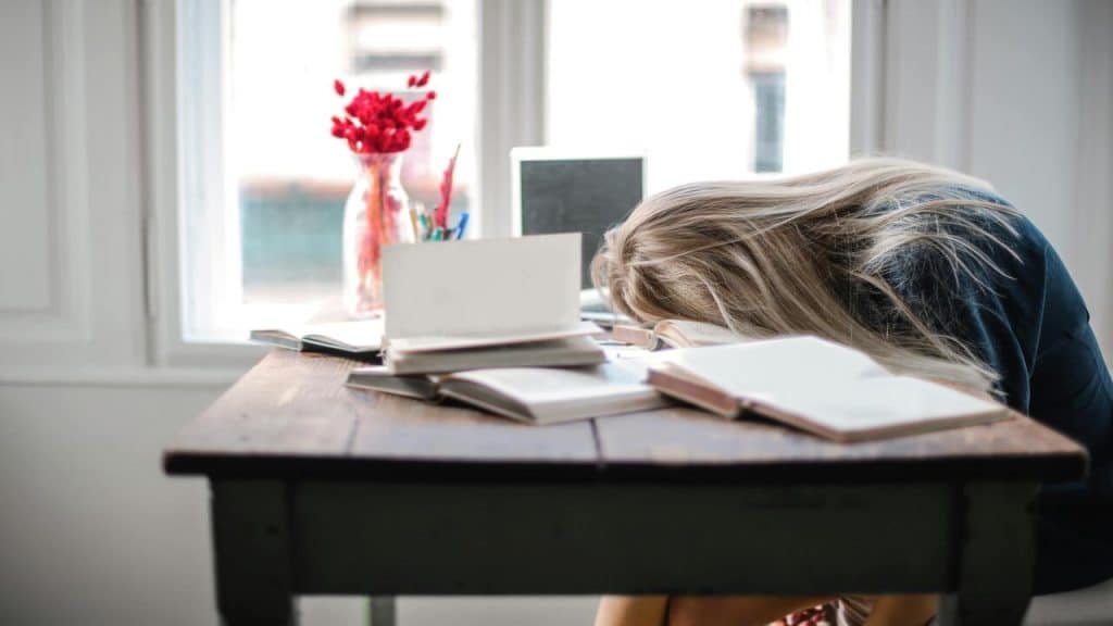 A woman looking tired at home