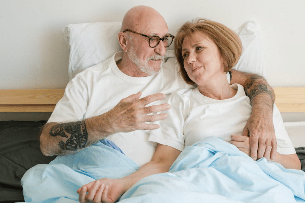 A couple lying and talking in the bed