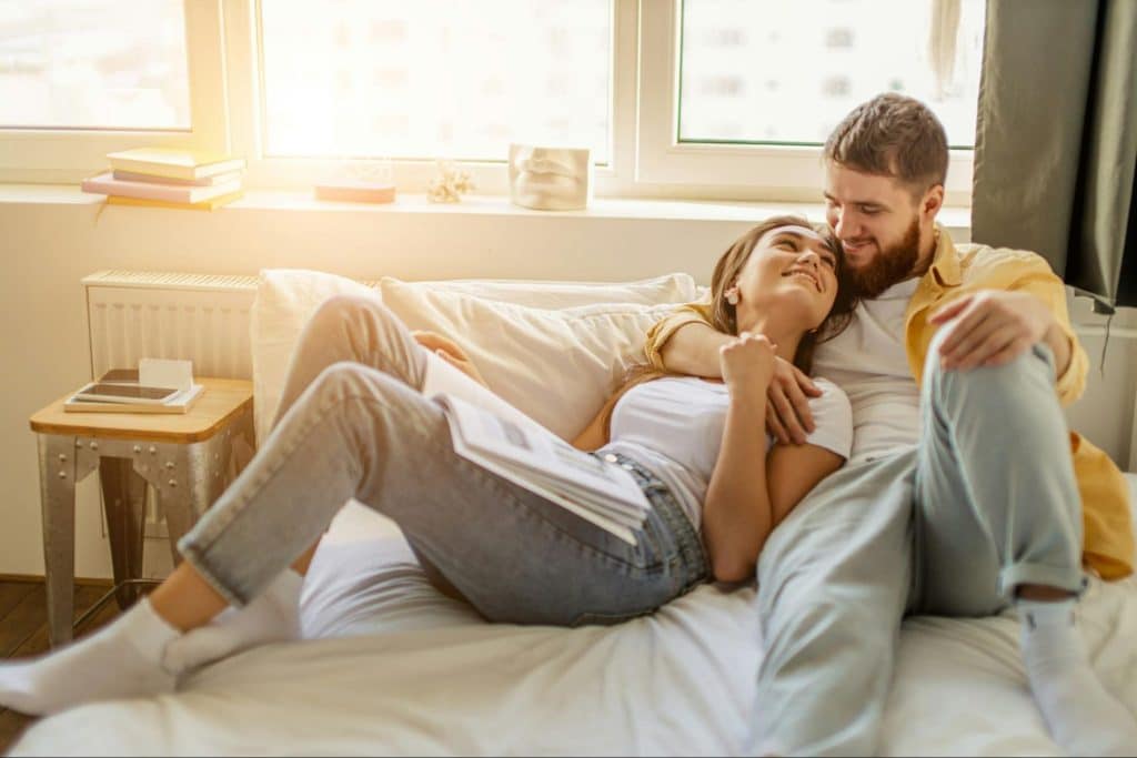 A woman resting on a man’s chest