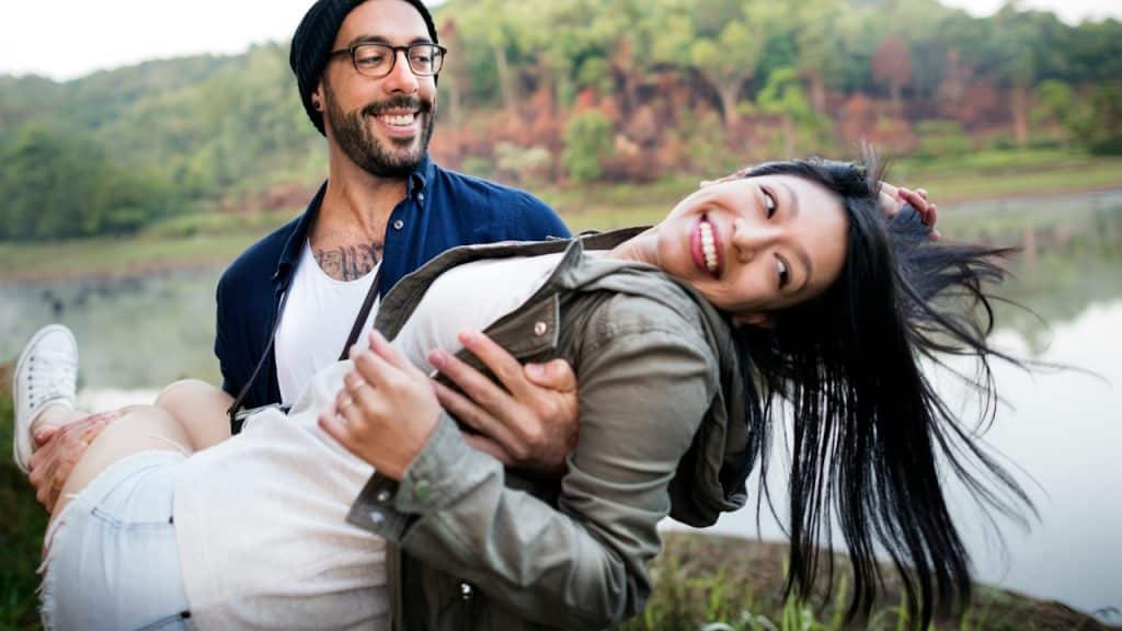 A man holding a woman in his arms.