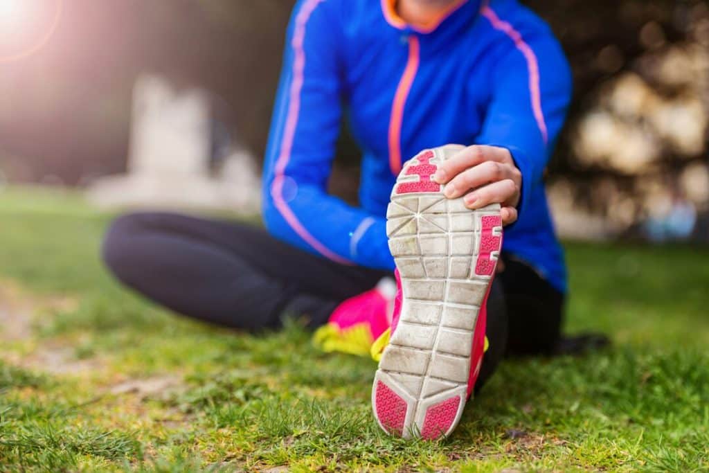 A woman stretching before running 