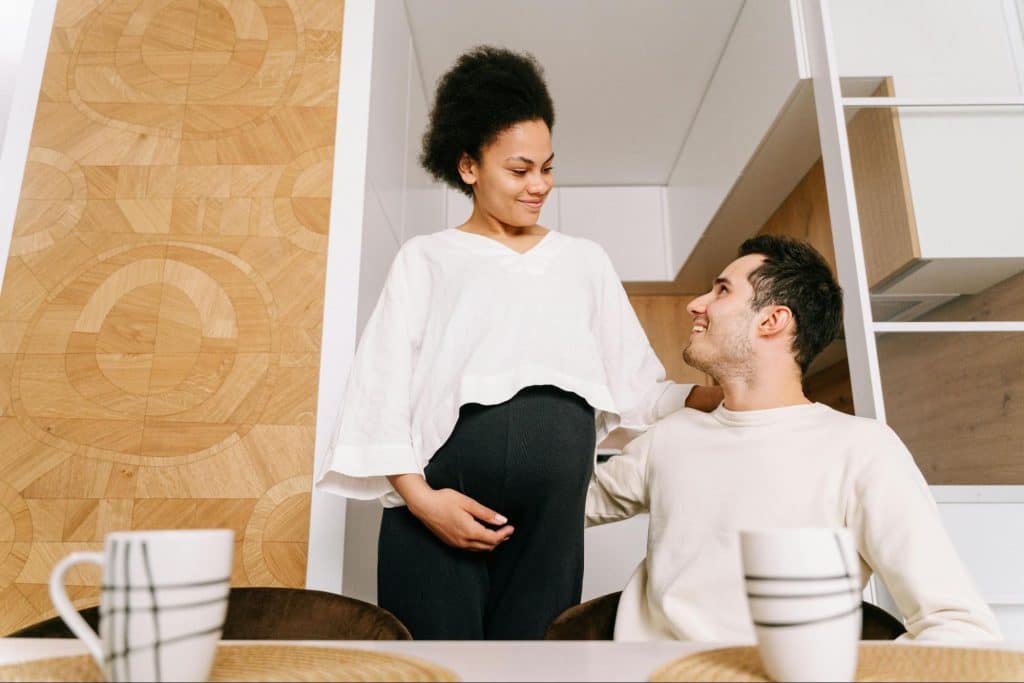 A man and woman smiling at each other