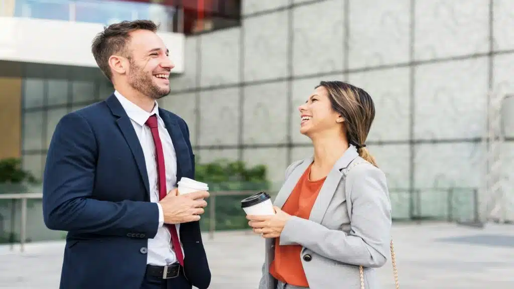 Colleagues laughing outside their work
