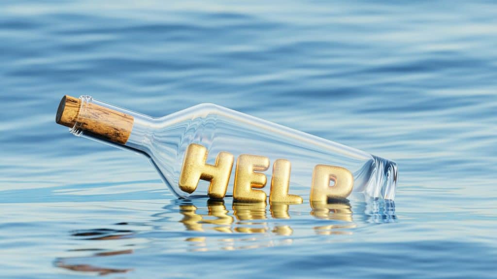 The word “help” in a floating bottle