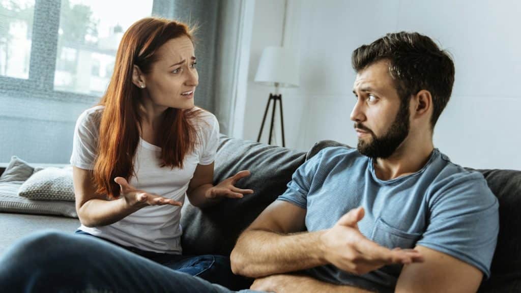 A young woman complaining to her indifferent husband.