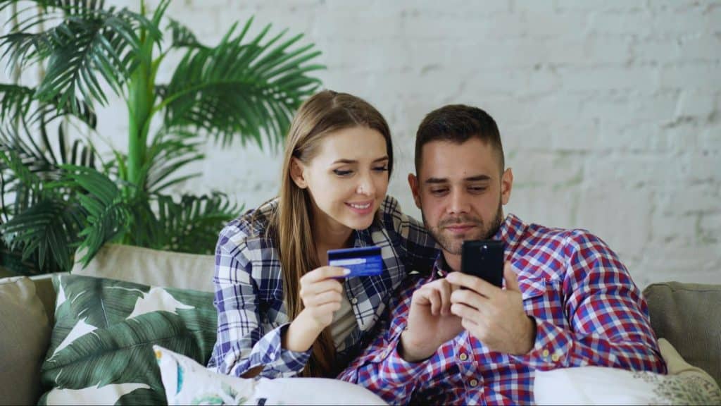 A woman holding a credit card