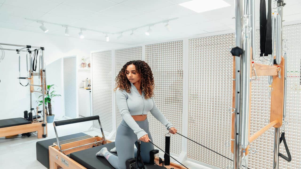 A woman at a pilates class 