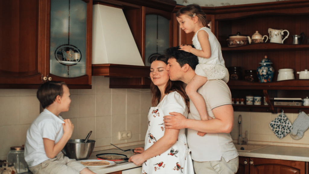 A man giving his wife a forehead kiss