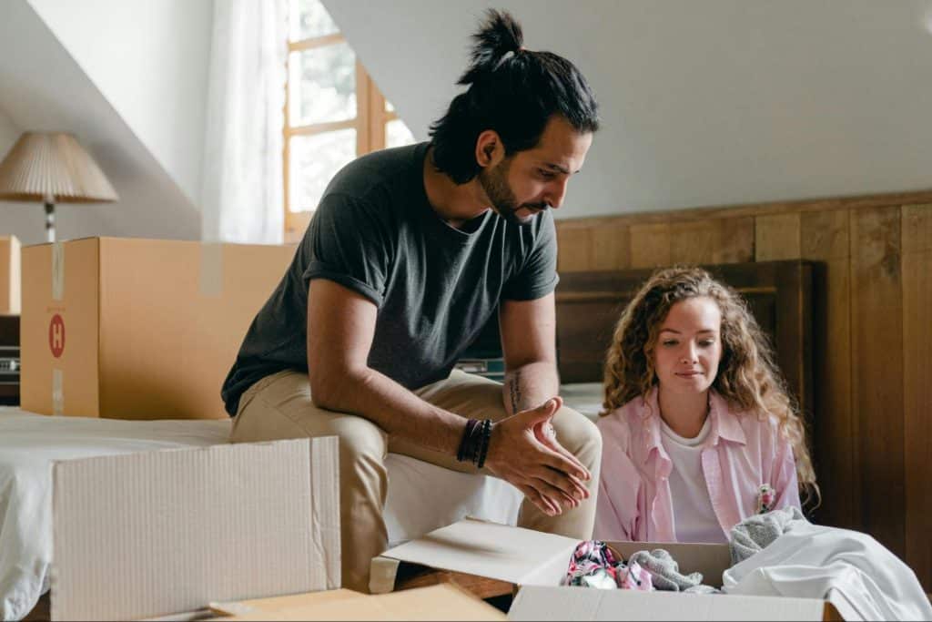 A man and woman talking serious