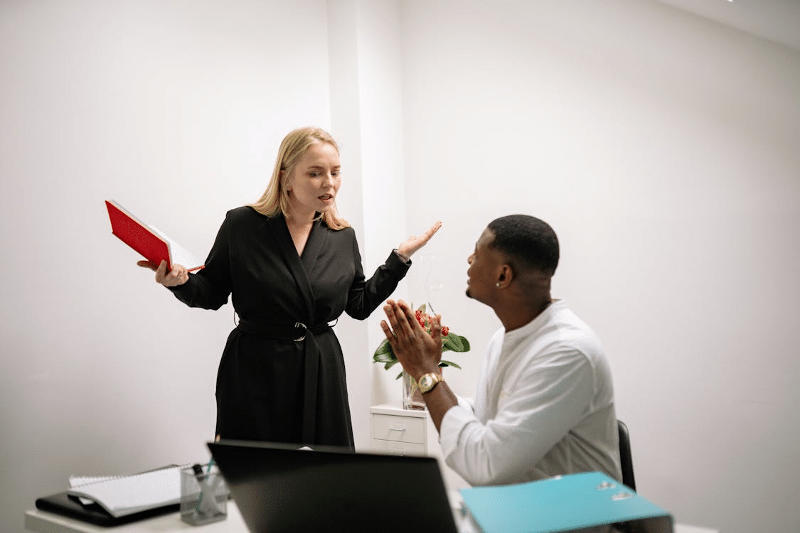 A man and woman having argument in the workplace