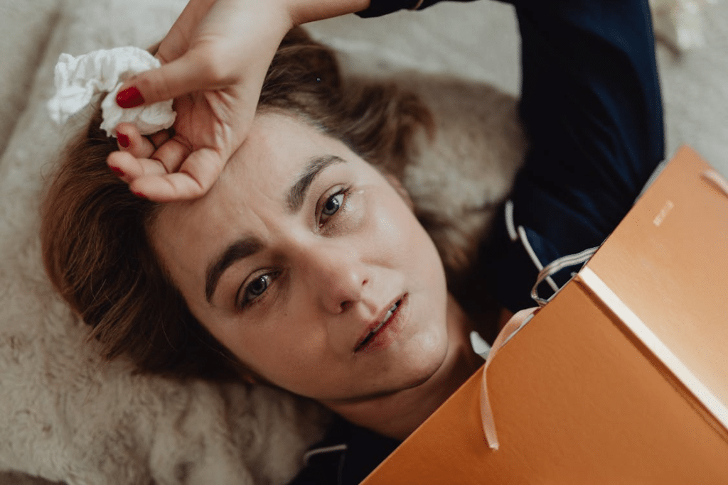 A crying woman lying down