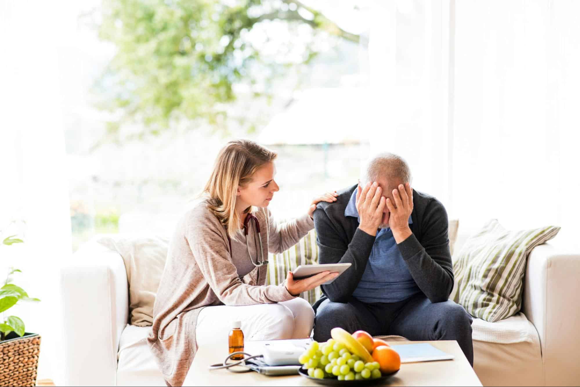 A woman checking on a man