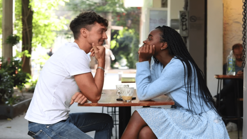 A couple mirroring each other on a date