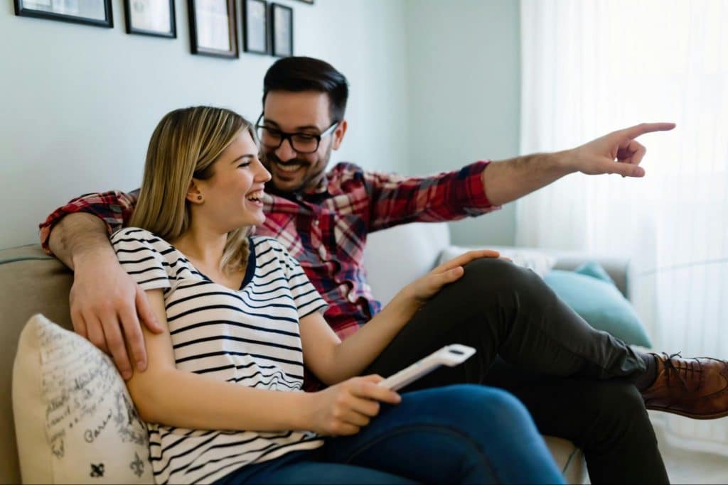 A man distracting a woman