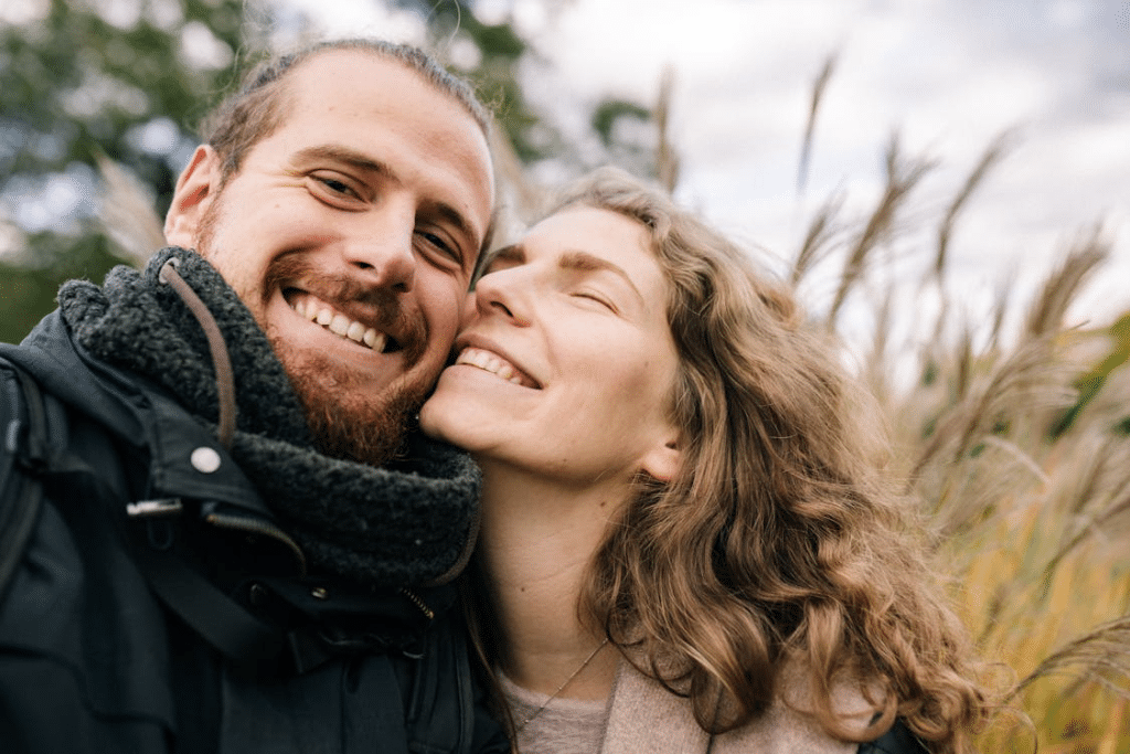 A man and woman smiling