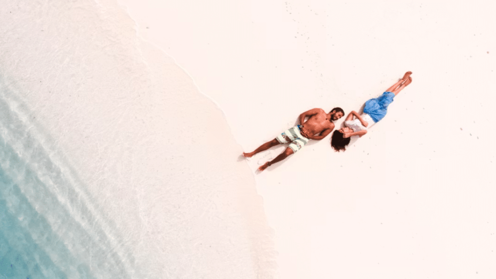 A couple relaxing on the beach